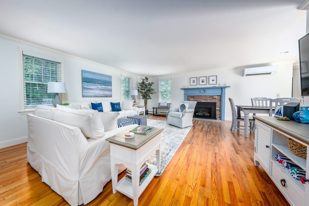 One more view of the living room, from the main entry hall. This space features a new mini split adjacent to the fireplace for your summertime comfort.