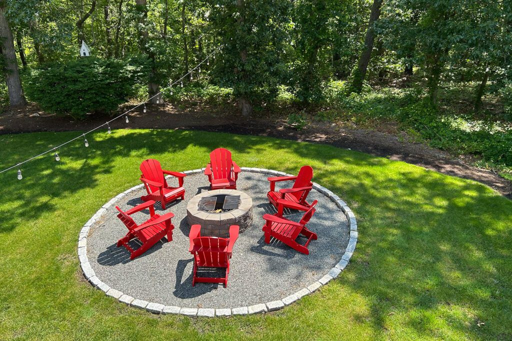 Around back, you can lounge around the new fire pit in the renovated backyard, enjoying a peaceful view of the surrounding wetlands.